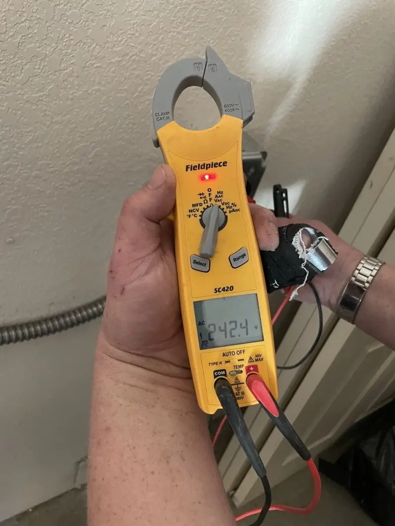 Voltage testing with clamp meter during Generator Installation in New York Mills